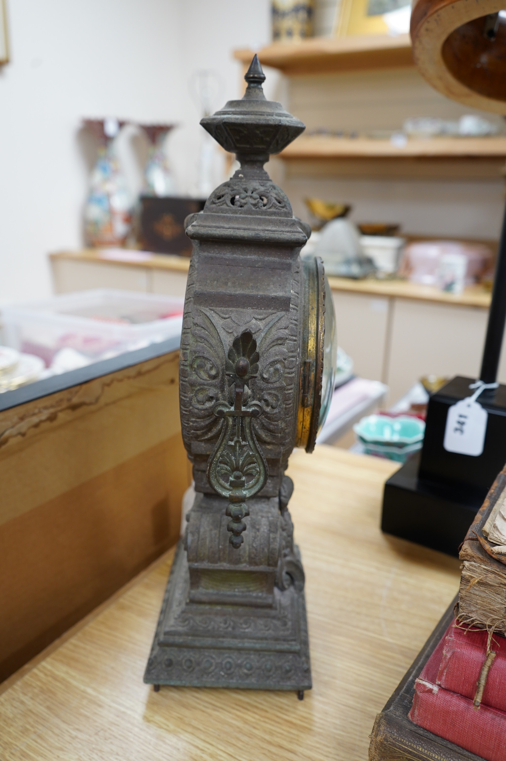 A spelter clock with enamel Arabic dial, 47cm high. Condition - poor to fair, untested